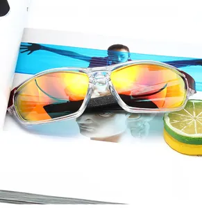 Detail of polarized sports sunglasses featuring transparent frames and orange gradient lenses