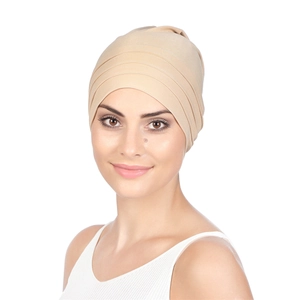 Close-up of beige pleated headscarf fabric with high-elasticity cotton texture for women