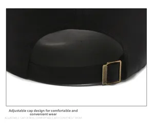 Detail of adjustable metal buckle and black cotton twill strap on baseball cap
