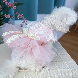 Detailed close-up of pink pet princess dress with layered mesh tulle and lace bow