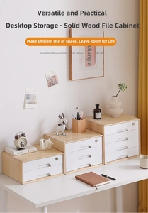 Close-up of wooden desktop file cabinet with white lockable drawers and natural grain