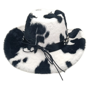 Detailed view of plush cow print cowboy hat with studded leather band and adjustable strap