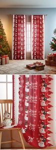 Detail of Christmas curtain fabric showing cute snowman patterns and festive Merry Christmas text