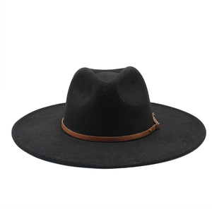 Detail of black wool fedora hat with a slim brown leather band and metal buckle