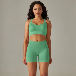 Mint green seamless yoga set with V-neck sports bra and high waisted fitness shorts