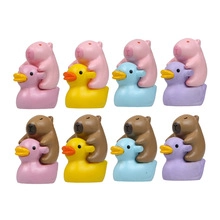 Set of eight miniature capybara figures riding colorful ducks for desktop garden decor