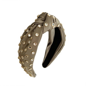 Olive green satin knotted headband with rhinestones in golden metal settings