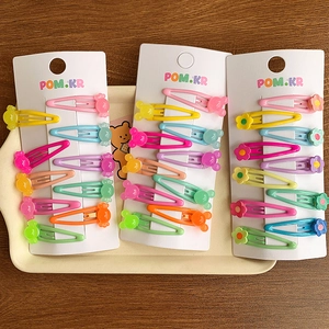 Colorful star and flower jelly candy color hair clips for girls set on a tray