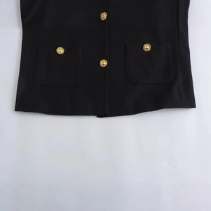 Women's black textured jacket featuring elegant gold buttons and symmetrical double pockets