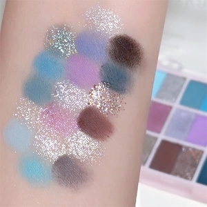 Arm swatches of 18-color eyeshadow palette with matte and shimmer textures