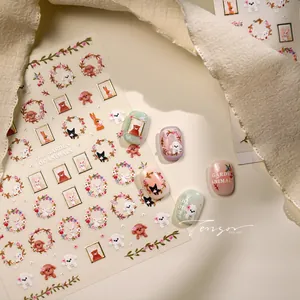 Detail of cute dog and rabbit nail stickers with floral patterns on polished nails