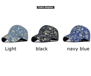 Detailed close-up of textured hip hop baseball caps with gold floral print in three colors