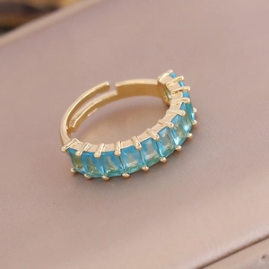 Adjustable 18K gold plated ring featuring vibrant blue rectangular cubic zirconia stones