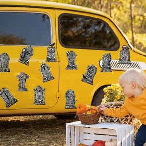 Halloween tombstone magnets with RIP and Keep Out text displayed on a yellow car