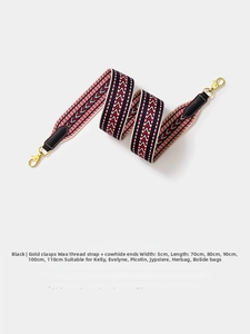 Close-up of 5cm wide red and black chevron woven strap with gold metal lobster clasp