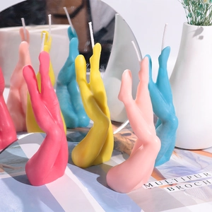 Artistic sexy leg-shaped candle with detailed curves and colorful decorative wax texture