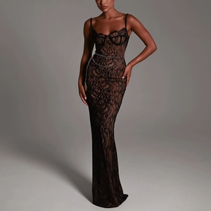 Detail of elegant black lace maxi dress with backless design and metal chain belt