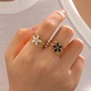 Elegant 18K gold plated stainless steel layered flower rings in black and white enamel