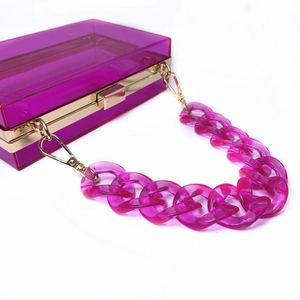 Clear purple acrylic crossbody bag with chunky chain strap and gold hardware accents