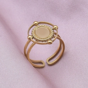 Macro view of gold vintage sunburst oval ring with a double-layered adjustable band