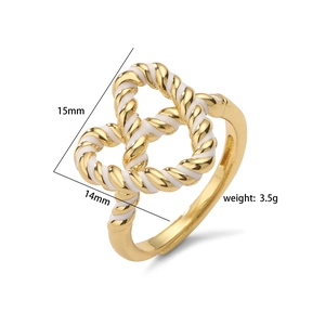 Gold pretzel heart knot ring with white enamel, dimensions 15mm x 14mm and 3.5g weight