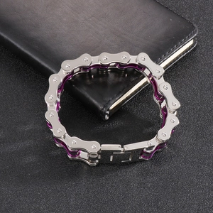 Detailed shot of purple and silver bicycle chain bracelet on black leather accessory