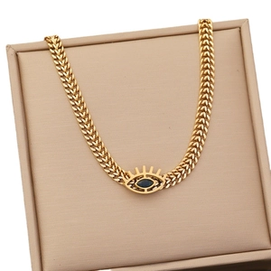 Golden stainless steel necklace with evil eye pendant and blue gemstone in a gift box