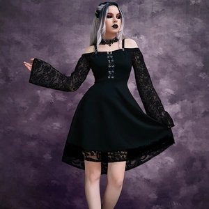 Gothic black dress with lace sleeves, lace-up front, and cold-shoulder cut on purple background