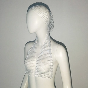 Detail of silver elastic rhinestone mesh headband with glittering stones on a white mannequin