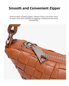 Macro shot of silver triangle zipper on woven caramel leather shoulder bag with smooth closure