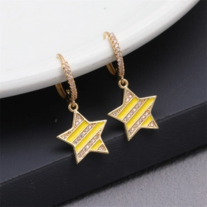Macro view of gold star earrings featuring yellow enamel and micro-pave cubic zirconia