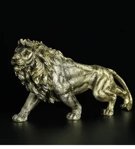 Close-up of golden resin lion sculpture showing detailed mane and muscle textures