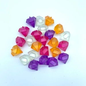 Close-up of diamond-shaped reusable plastic ice cubes in vibrant mixed colors