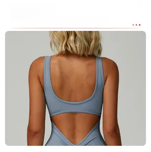 Detail of blue high-elastic yoga bodysuit showing cutout back and racerback design