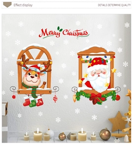 Christmas window decals showing Reindeer and Santa Claus stickers on a gray wall