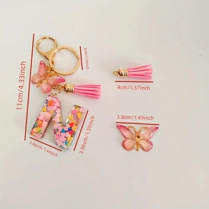 Detailed dimensions of pink resin letter N keychain with butterfly and tassel charm