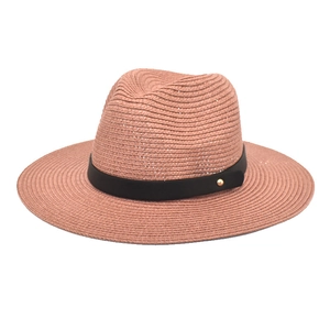 Close-up of the dusty rose paper straw fedora hat featuring a black band with gold stud