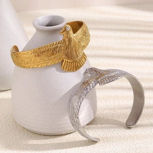 18K gold and silver eagle-shaped open cuff bracelets with sparkling wing feather details