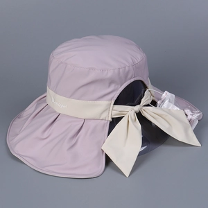Detail view of pink UV sun hat with neck flap, bow tie, and detachable face shield