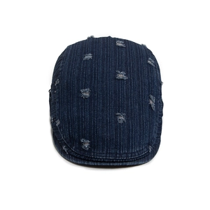 Deep blue denim distressed beret with vintage ripped details and vertical stripe texture