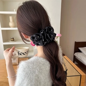 Polka dot bubble banana hair clip for low hair volume shown on model back view