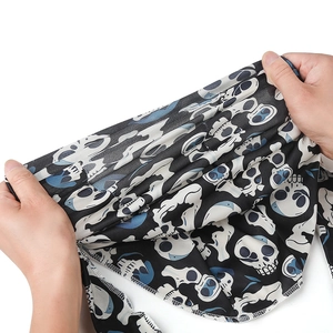 Detail showing the high elasticity and stretchable fabric of the skull print bandana
