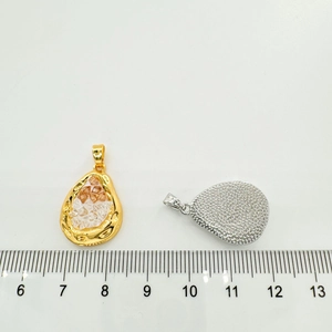 Macro view of 18K gold-plated heart fishtail pendant showing 2.5cm size measurement