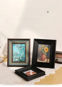Detail of vintage French frames in gold and black with ornate textures for wall decor
