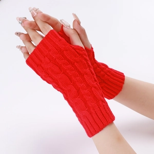 Close-up of red cable knit arm warmer showing detailed texture and fingerless design
