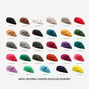 Classic wool beret for women in 29 different solid colors with metal logo detail
