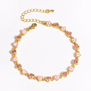 Detail of pink heart enamel links and gold-plated lobster clasp on the stylish bracelet