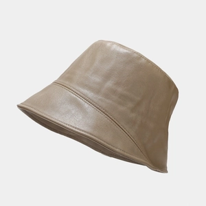 Detailed view of stitching and texture on a premium brown PU leather bucket hat
