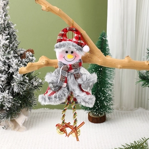 Detail of Christmas snowman ornament with golden bells hanging on a wooden branch