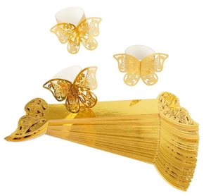 Detail of golden laser-cut butterfly cupcake wrappers with metallic luster finish